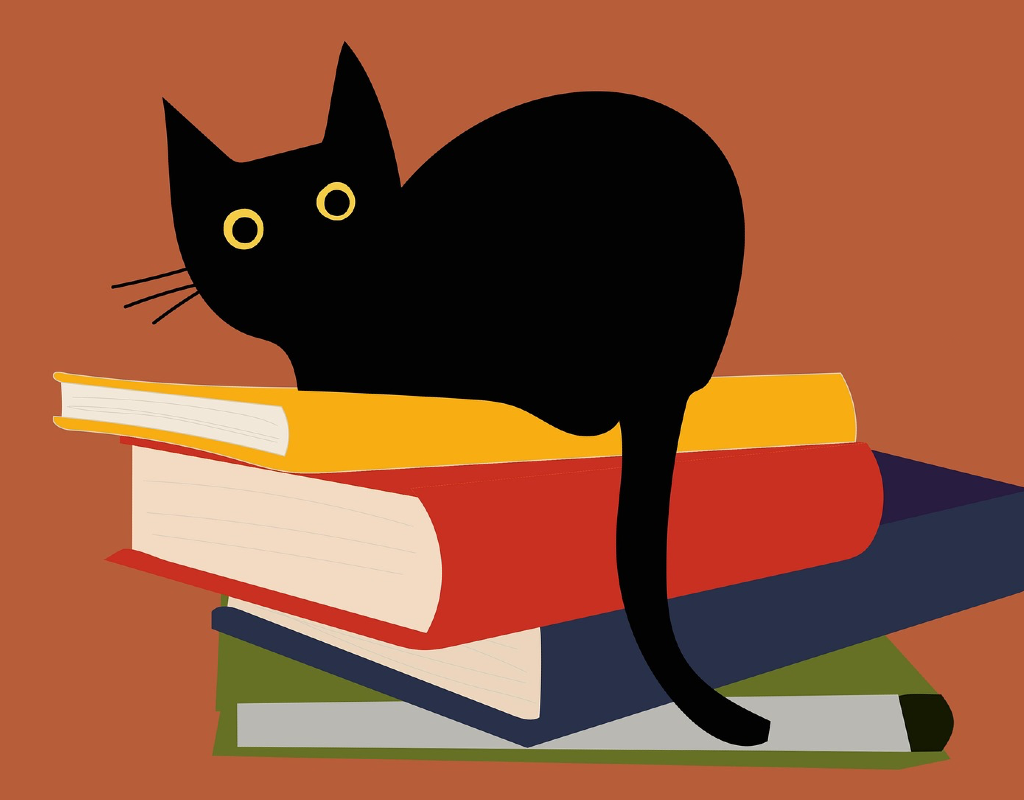 cat sitting on pile of books